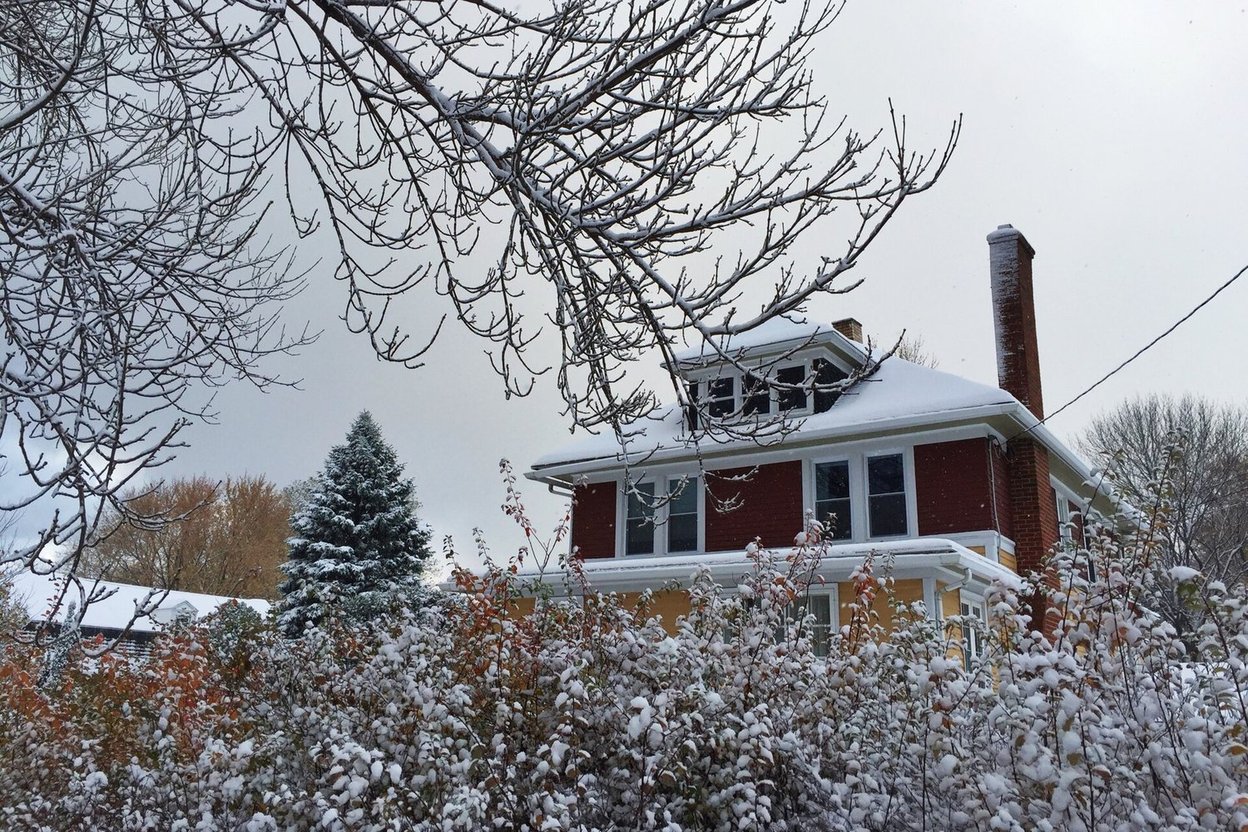 A house covered in snow in winter