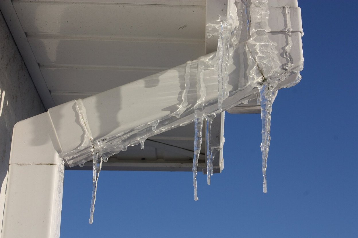 Icicles hanging from a gutter on a house