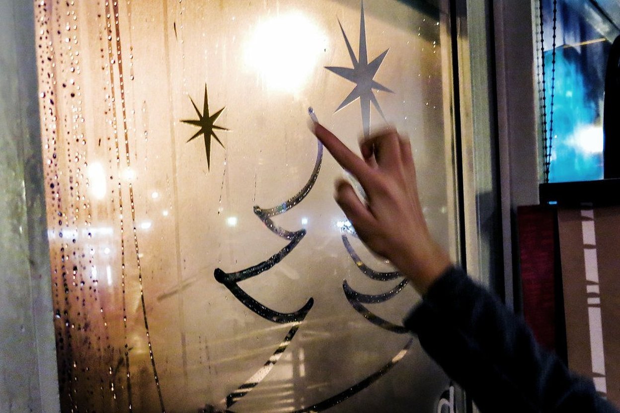 Condensation droplets and frost on a window pane on a cold winter morning